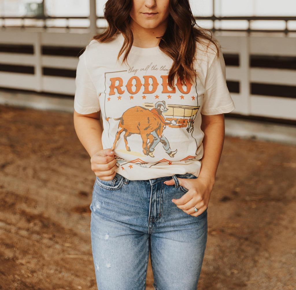 THEY CALL THE THING A RODEO GRAPHIC T SHIRT