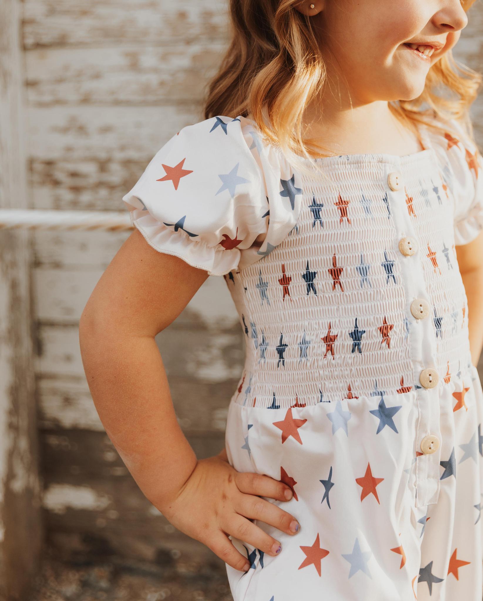 STAR PRINT SMOCKED GIRL JUMPSUIT
