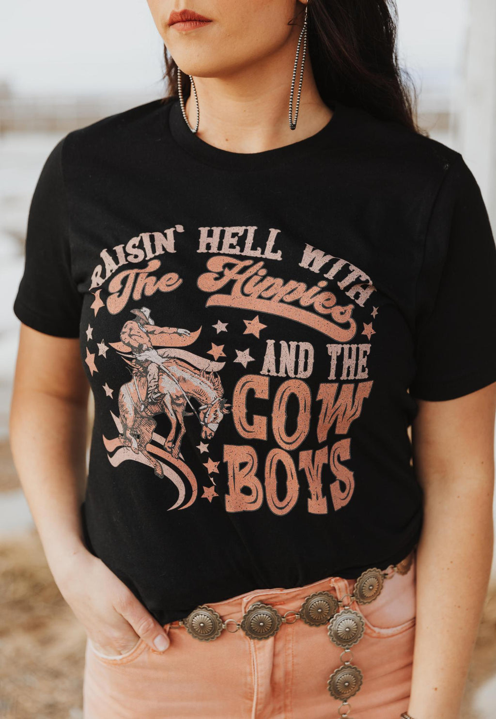 RAISIN HELL WITH THE HIPPIES & THE COWBOYS GRAPHIC TOP - BLACK