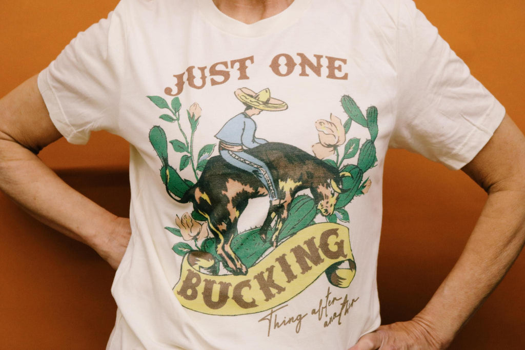 JUST ONE BUCKING THING AFTER ANOTHER GRAPHIC T SHIRT