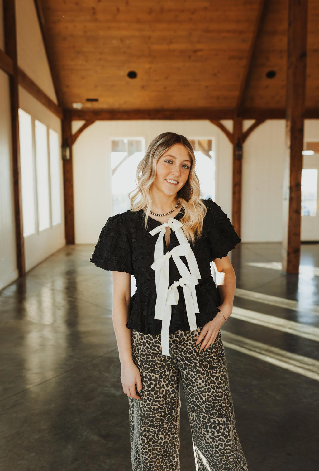 Bubble Babydoll Blouse with Textured Fabric and Contrast Bow - Black